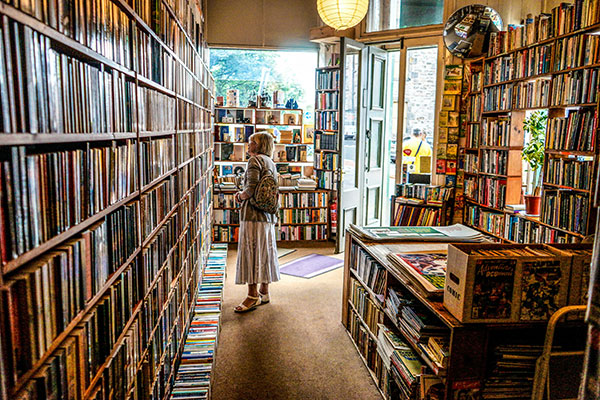 Woman browsing in Library in Wrexham